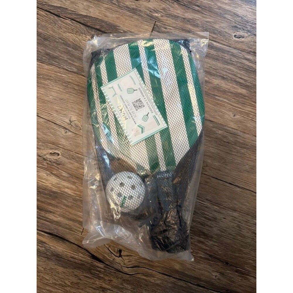Set of pickleball paddles with bag and ball.